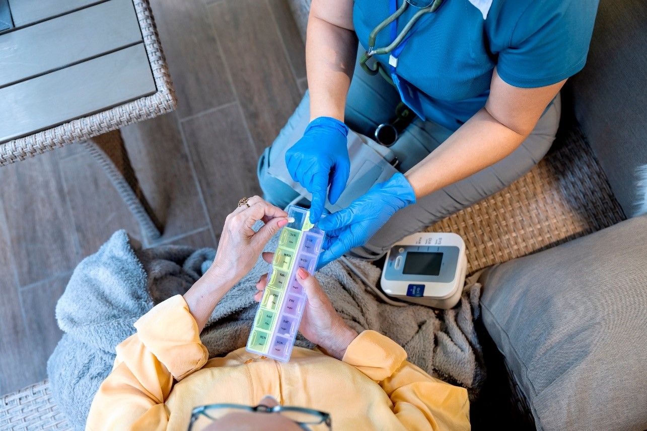 patient and nurse holding medication box.jpg